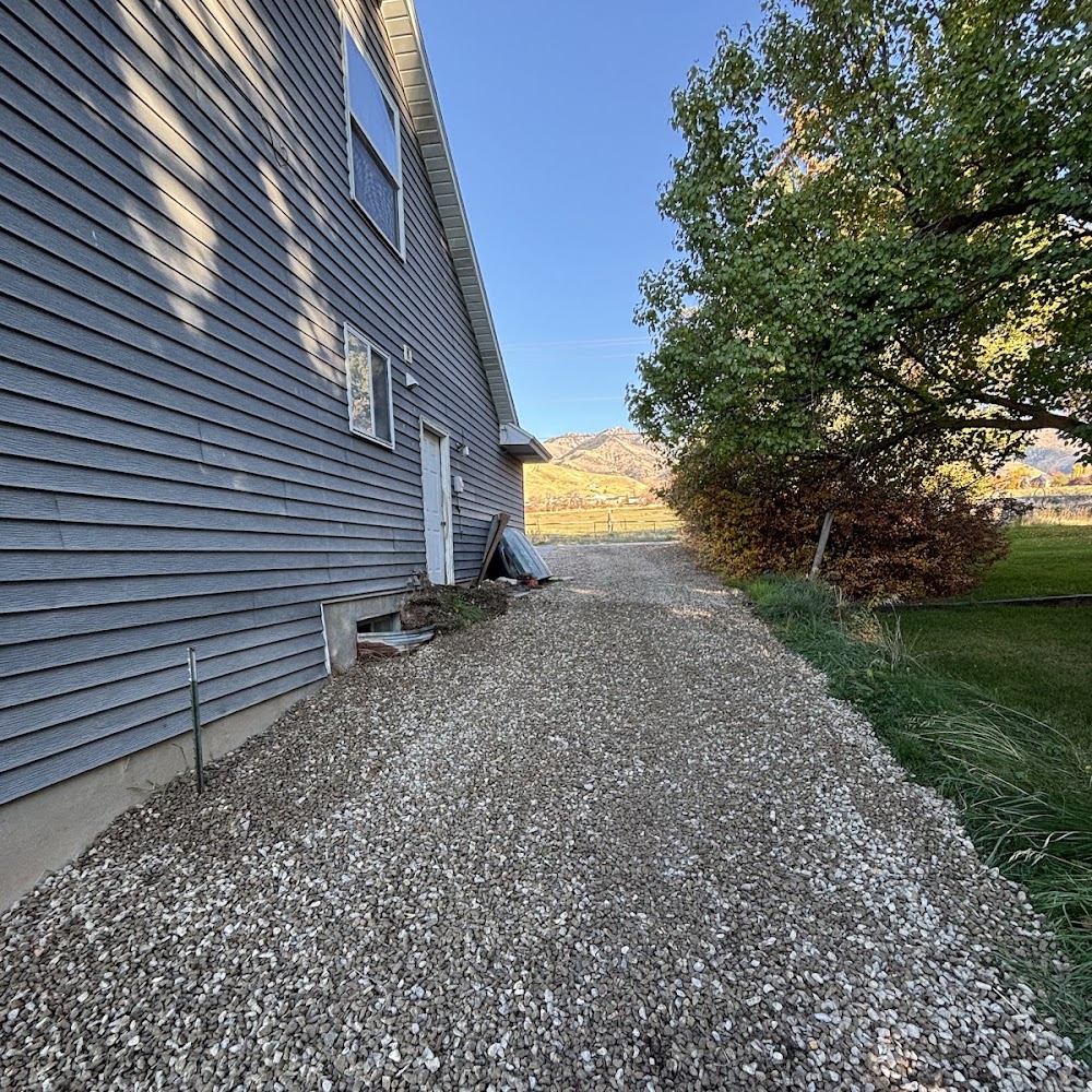 Fresh gravel run alongside the house